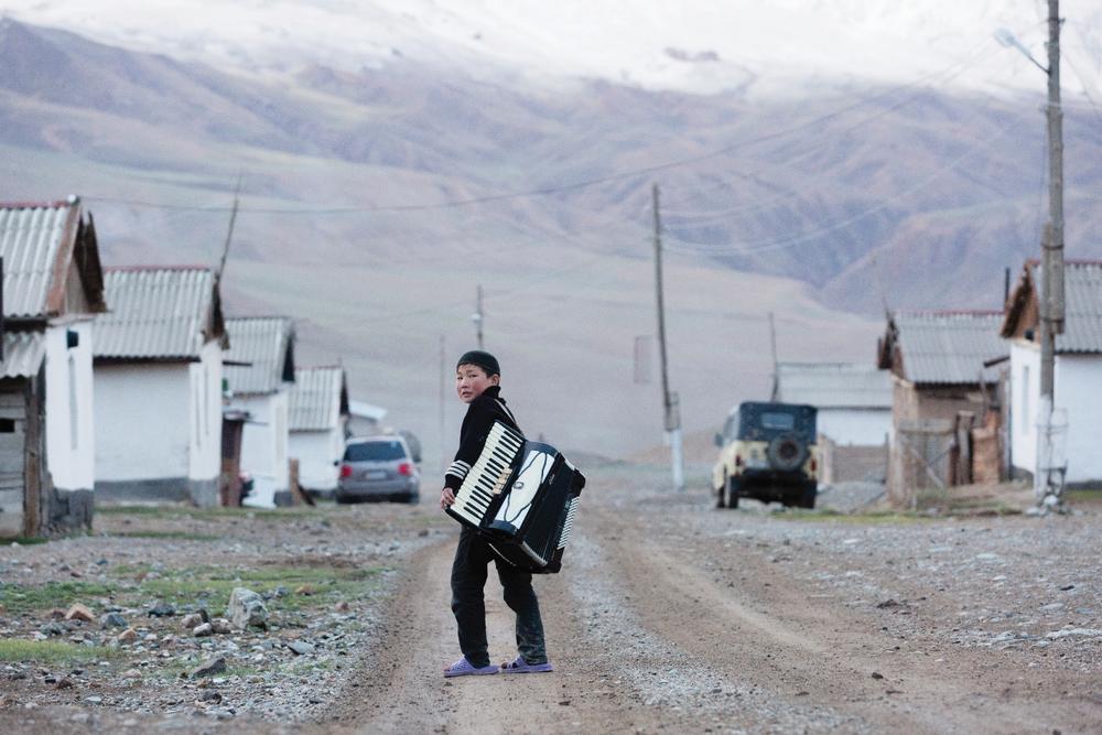A Kyrgyz boy on the main road in the small, high-mountain village of Ak-Shyrak, a WWF project site.