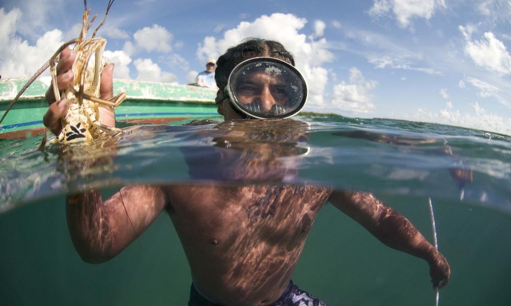 man holds lobster