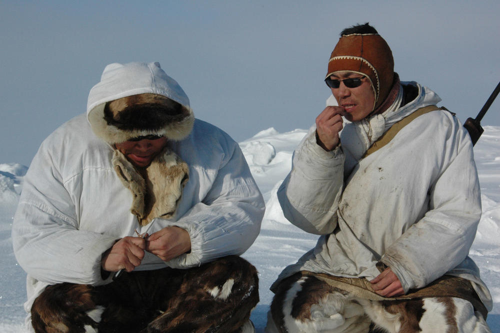 Vladilen and Sergey Kavriy, Chukchi brothers, rest and eat.