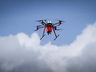 drone flying and delivering bait