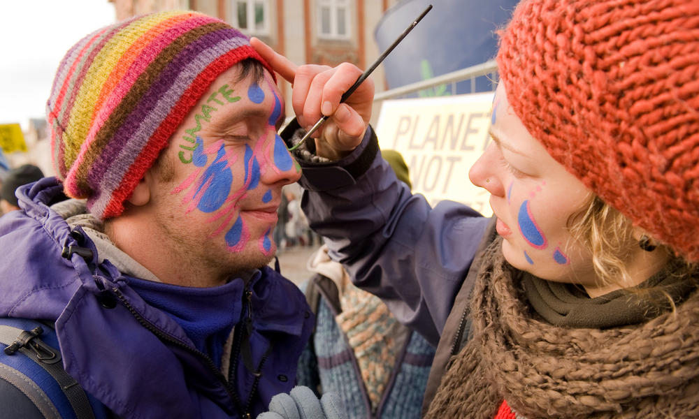 Face painting at a climate march