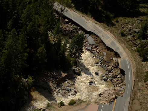 Flood damage to a road in Boulder, CO.