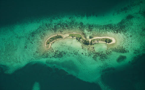 Laughing Bird Caye National Park Aerial view of coral reef from 6,000 ft. Belize