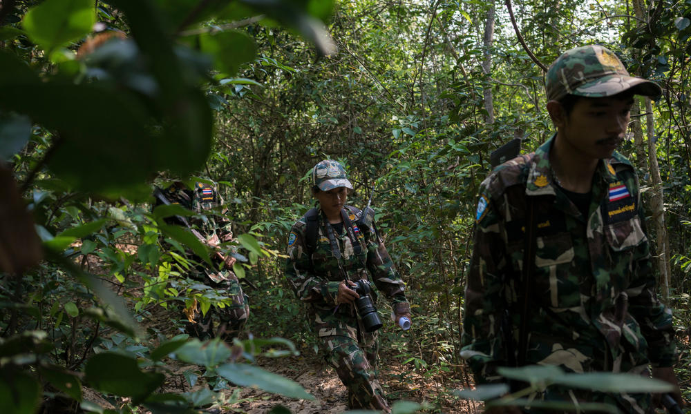 Woraya Makai (34) walks through the jungle during a morning patrol together with a team of rangers.