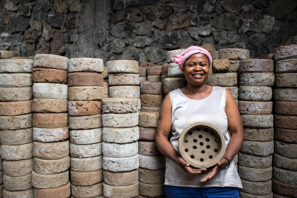 veline Kahindo with clay stove base