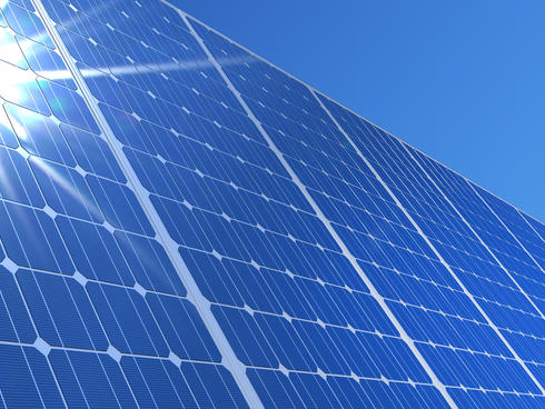 solar panels reflecting sun