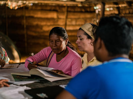 An Ecosystem Services Assessment Technical Team review the data collected during an ESA of the forest surrounding La Chorrera, Predio Putumayo Indigenous Reserve, Colombia