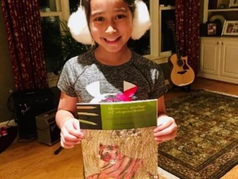 Petra Demas holding art