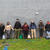 Groundwork Ohio River Valley’s Green Team stands in front of a grey wall holding hands