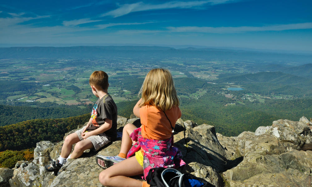 Owen and Audrey look west from a ridge