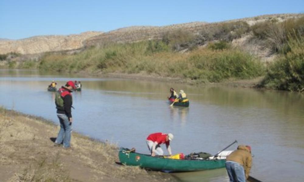People canoeing down Rio Grande