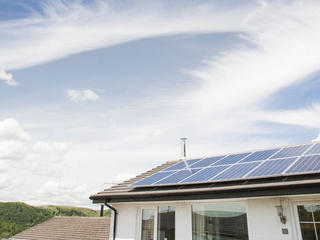 Solar panels on a house in Ambleside, Lake District, UK.