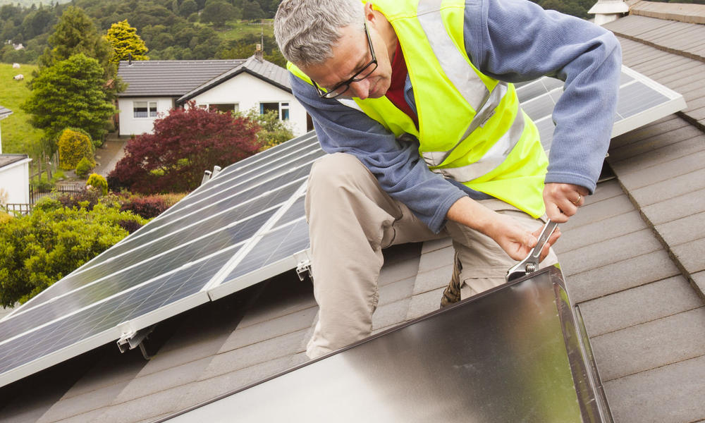 man adding solar